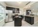 Open concept kitchen with island, stainless appliances, and granite countertops at 58 Lake Village Drive Dr, Durham, NC 27713