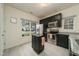 Well-lit kitchen with stainless steel appliances and island for extra counter space at 58 Lake Village Drive Dr, Durham, NC 27713