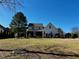Sprawling backyard with two story home in distance at 61 Langdon Pointe Dr, Garner, NC 27529