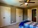 Bedroom with carpet, two closets and a ceiling fan at 61 Langdon Pointe Dr, Garner, NC 27529