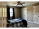 Bedroom with carpet, ceiling fan, and a window with curtains at 61 Langdon Pointe Dr, Garner, NC 27529