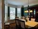 Elegant dining area with ample natural light, a decorative chandelier, and classic furniture at 61 Langdon Pointe Dr, Garner, NC 27529