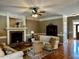 Comfortable living room featuring a fireplace, plush seating, and lots of natural light at 61 Langdon Pointe Dr, Garner, NC 27529