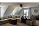 Spacious living room featuring neutral tones, a comfortable sectional sofa, and a cozy armchair at 61 Langdon Pointe Dr, Garner, NC 27529