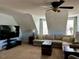 Cozy living room with a modern TV setup, neutral tones and a comfortable sectional sofa at 61 Langdon Pointe Dr, Garner, NC 27529