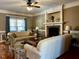 Inviting living area with a fireplace, lots of natural light, and comfortable seating at 61 Langdon Pointe Dr, Garner, NC 27529