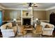 Cozy living room with a fireplace, comfortable seating, and an inviting atmosphere at 61 Langdon Pointe Dr, Garner, NC 27529