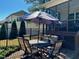 A patio with a dining table and chairs, perfect for outdoor dining and gatherings at 61 Langdon Pointe Dr, Garner, NC 27529