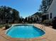 Backyard pool with lounge chair on concrete patio at 61 Langdon Pointe Dr, Garner, NC 27529