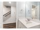 Bathroom with a large mirror and white vanity showcasing modern fixtures at 6434 Astor Elgin St, Raleigh, NC 27616