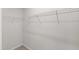 Walk-in closet features white wire shelving and carpeted floor at 6434 Astor Elgin St, Raleigh, NC 27616