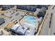 Aerial view of a sparkling community pool with lounge seating, pergola, and nearby playground at 6434 Astor Elgin St, Raleigh, NC 27616