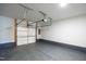 Spacious two car garage with modern door opener and sealed concrete floor, ready for vehicles or storage at 6434 Astor Elgin St, Raleigh, NC 27616