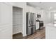 Pantry and modern stainless steel appliances complete the functional kitchen design at 6434 Astor Elgin St, Raleigh, NC 27616