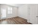 Bright living room with ample natural light and hardwood flooring at 6434 Astor Elgin St, Raleigh, NC 27616