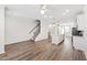 Spacious open-concept living room and kitchen with hardwood floors at 6434 Astor Elgin St, Raleigh, NC 27616
