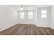 Spacious living room with hardwood floors, ceiling fan and lots of natural light at 6434 Astor Elgin St, Raleigh, NC 27616