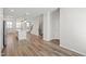 Spacious open-concept living area with a modern kitchen and hardwood floors at 6434 Astor Elgin St, Raleigh, NC 27616