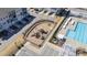 Aerial view of a well-maintained community playground with modern play equipment and a secure fenced perimeter at 6434 Astor Elgin St, Raleigh, NC 27616