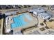 Aerial view of the community pool featuring a lap pool, seating, shade and a recreation center at 6434 Astor Elgin St, Raleigh, NC 27616