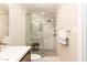 Modern bathroom with a glass-enclosed shower, elegant tile work, and sleek fixtures at 700 Bishops Park Dr # 205, Raleigh, NC 27605