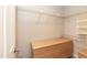 Walk-in closet with dresser, shelving, and a neutral color palette at 700 Bishops Park Dr # 205, Raleigh, NC 27605