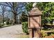 A brick sign marking the entrance to Bishops Park neighborhood at 700 Bishops Park Dr # 205, Raleigh, NC 27605