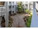 Overhead view of a landscaped courtyard surrounded by condos at 700 Bishops Park Dr # 205, Raleigh, NC 27605