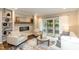 Comfortable living room featuring a fireplace, built-in shelving, and sliding doors to the outdoor area at 700 Bishops Park Dr # 205, Raleigh, NC 27605