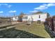 Exterior view of a home with a fenced backyard, patio, and mature trees providing shade at 71 Oak Trace Dr, Four Oaks, NC 27524