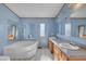 Spacious bathroom featuring a soaking tub, double sinks, and a large vanity with plenty of counter space at 71 Oak Trace Dr, Four Oaks, NC 27524