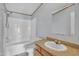 Cozy bathroom featuring a tub-shower combo, neutral accents, and a light-colored vanity at 71 Oak Trace Dr, Four Oaks, NC 27524