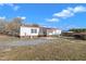 Home exterior showcasing a metal roof, vinyl siding, and a well-maintained backyard with a patio at 71 Oak Trace Dr, Four Oaks, NC 27524