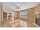 The living room features wood-look floors, a ceiling fan and a fireplace at 71 Oak Trace Dr, Four Oaks, NC 27524
