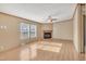 The living room features wood-look floors, a ceiling fan and a fireplace at 71 Oak Trace Dr, Four Oaks, NC 27524