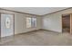This spacious living room features neutral carpet and a front door entrance at 71 Oak Trace Dr, Four Oaks, NC 27524