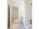 Bathroom showcasing a tiled shower and a doorway leading to another room, offering a peek into the home's layout at 7216 Bluffside Ct, Raleigh, NC 27615