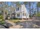 A charming home featuring a side view, complete with a spacious driveway and mature trees at 7216 Bluffside Ct, Raleigh, NC 27615