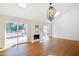Open-concept living area with hardwood flooring, fireplace, skylights and sliding doors to outdoor deck at 7216 Bluffside Ct, Raleigh, NC 27615