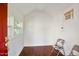 Cozy interior of shed with hardwood floors, AC unit, and two windows offering natural light at 7216 Bluffside Ct, Raleigh, NC 27615
