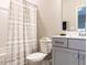 Cozy bathroom featuring a shower-tub combination, toilet, and vanity with modern fixtures and neutral tones at 730 Firebrick Drive Dr, Cary, NC 27519