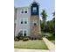 Two-story townhouse with a blend of brick and siding, complemented by a well-manicured lawn and sidewalk at 730 Firebrick Drive Dr, Cary, NC 27519