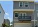 Modern townhome featuring a balcony and a well-maintained facade at 730 Firebrick Drive Dr, Cary, NC 27519