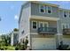 Contemporary townhome with a private balcony and attached garage at 730 Firebrick Drive Dr, Cary, NC 27519