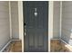 Stylish gray front door with a modern design and keyless entry at 730 Firebrick Drive Dr, Cary, NC 27519