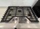 Close-up of a stainless steel gas range with sleek design and modern control knobs at 730 Firebrick Drive Dr, Cary, NC 27519