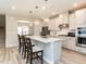 An open kitchen with a central island and seating for three at 730 Firebrick Drive Dr, Cary, NC 27519