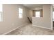 Neutral loft area with carpet and natural light at 730 Firebrick Drive Dr, Cary, NC 27519