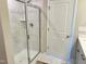 Shower featuring glass door, mosaic tile, and shower accessories at 730 Firebrick Drive Dr, Cary, NC 27519