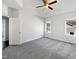 A sun-filled bedroom featuring plush carpet and two windows allowing for ample natural light at 80 Somerset Dr, Franklinton, NC 27525